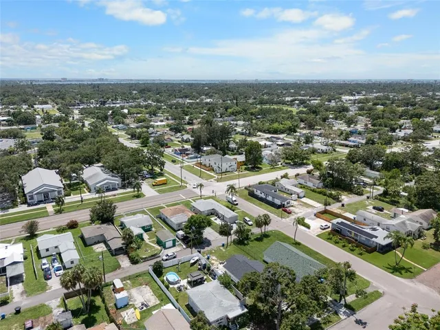 an aerial view of residential houses with outdoor space