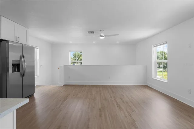 a view of an empty room with a window