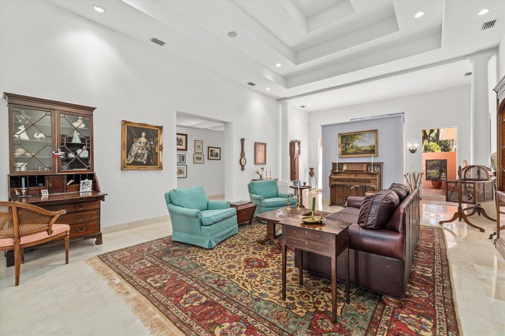4939 Peregrine Point Way Sarasota, FL 34231 - Photo 12 of 57 a living room with furniture and wooden floor