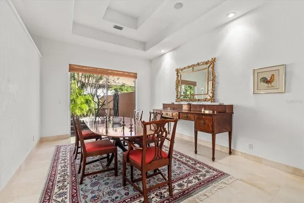 a bedroom with a bed and glass top table