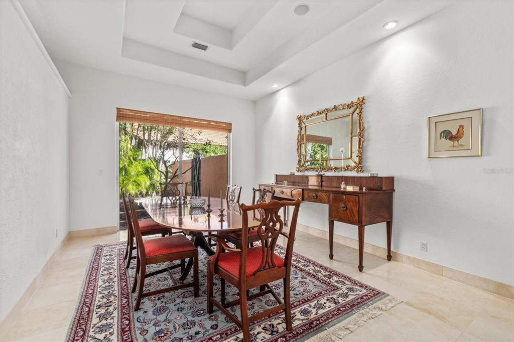 4939 Peregrine Point Way Sarasota, FL 34231 - Photo 23 of 57 a view of a dining room with furniture window and outside view
