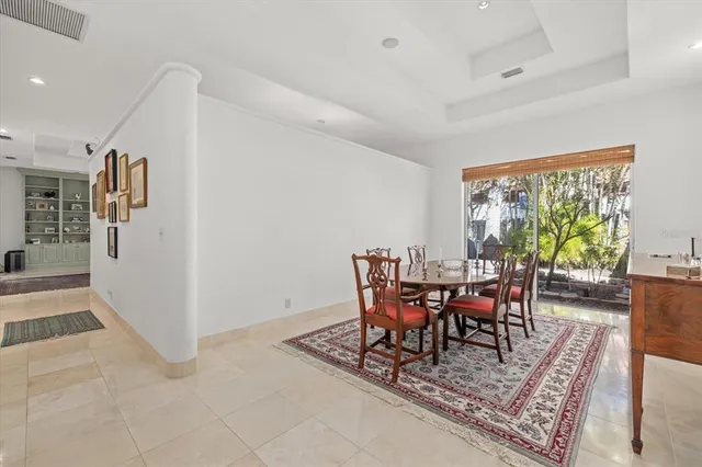 a bathroom with a granite countertop sink a mirror and a bathtub
