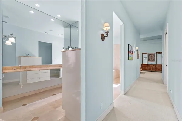 a spacious bathroom with a double vanity sink mirror and shower