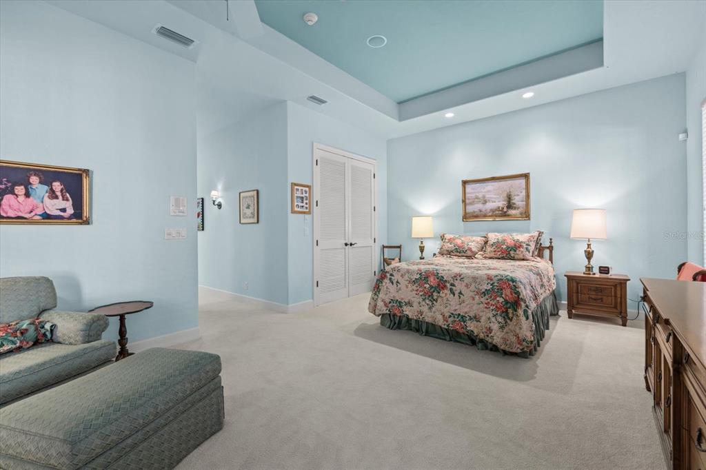 4939 Peregrine Point Way Sarasota, FL 34231 - Photo 26 of 57 a bedroom with a bed and a couch