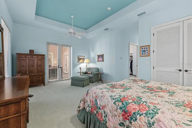 a bathroom with a toilet a sink and a shower curtain