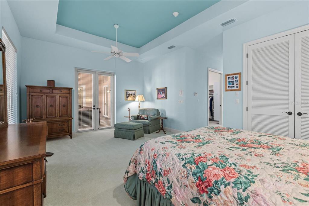 4939 Peregrine Point Way Sarasota, FL 34231 - Photo 27 of 57 a bedroom with a bed and furniture