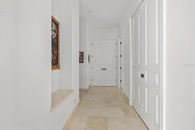 a bedroom with two beds and a couch