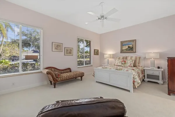 a bedroom with two beds and a couch