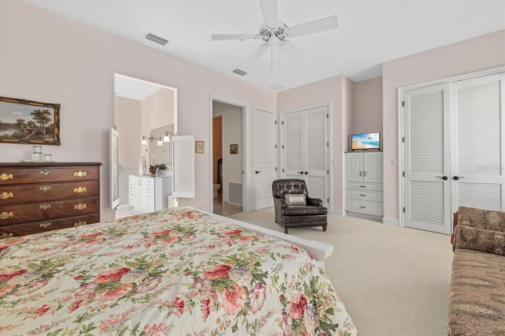 4939 Peregrine Point Way Sarasota, FL 34231 - Photo 37 of 57 a bedroom with a bed and a dresser