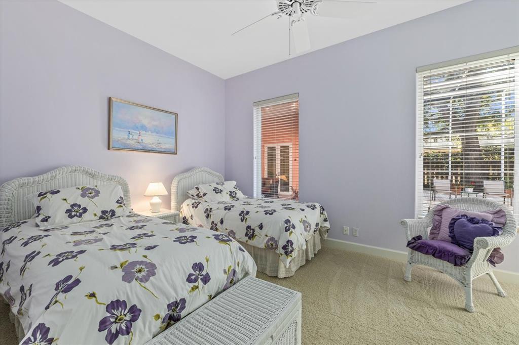 4939 Peregrine Point Way Sarasota, FL 34231 - Photo 40 of 57 a bedroom with two beds and a couch