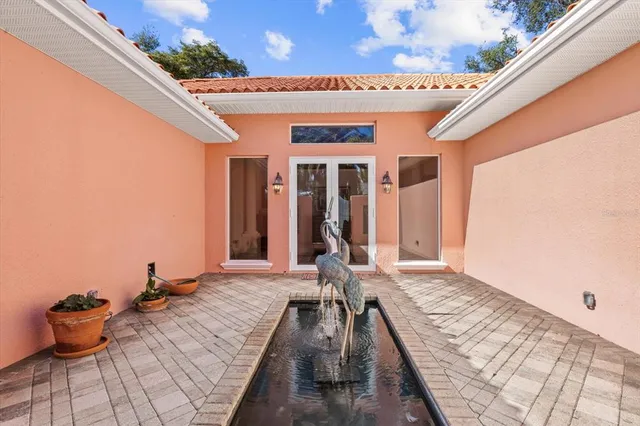 a living room with furniture and a dresser