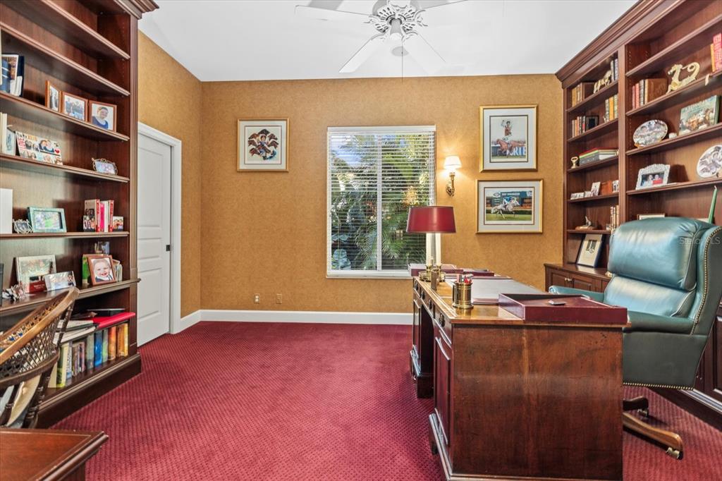 4939 Peregrine Point Way Sarasota, FL 34231 - Photo 42 of 57 a livingroom with workspace and a window