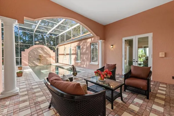 a view of a backyard with sitting area