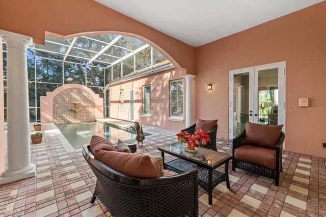 a view of a chairs and table in a patio