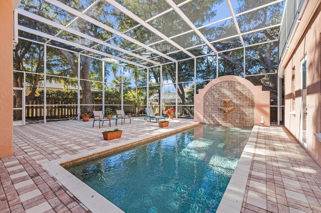 4939 Peregrine Point Way Sarasota, FL 34231 - Photo 48 of 57 a view of a swimming pool with a porch