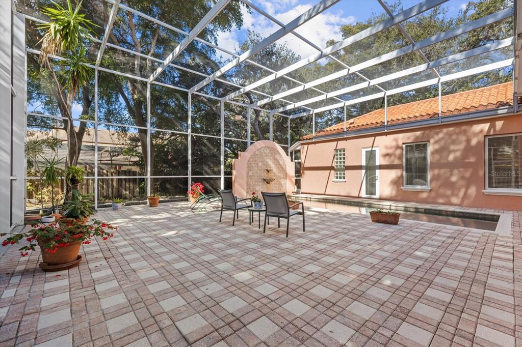 4939 Peregrine Point Way Sarasota, FL 34231 - Photo 54 of 57 a view of a chairs and table in a patio