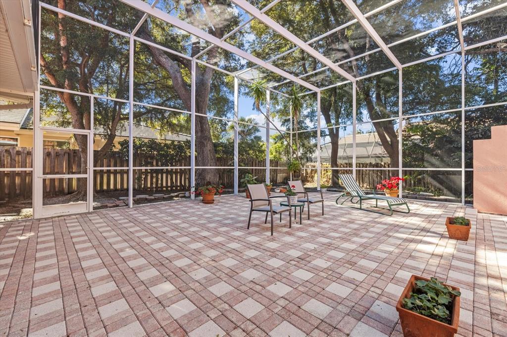 4939 Peregrine Point Way Sarasota, FL 34231 - Photo 55 of 57 a view of a swimming pool with a glass door and chair