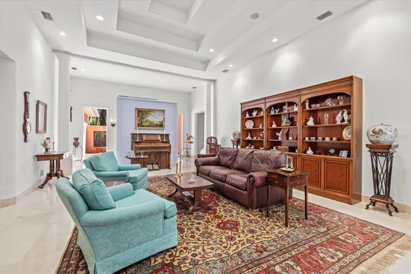 a living room with furniture and a rug