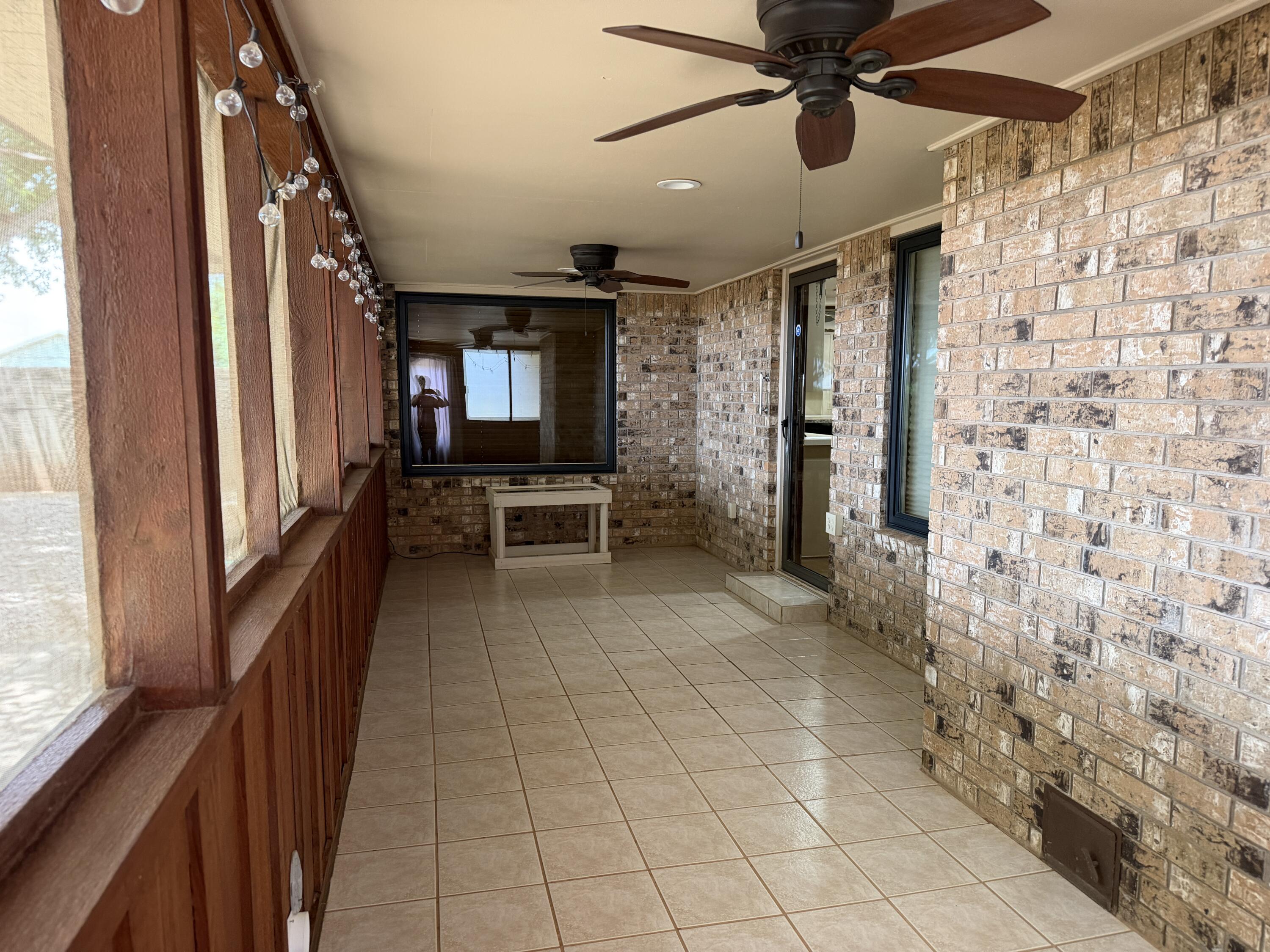 1603 South 8th Street Lamesa, TX 79331 - Photo 28 of 39 a view of a hallway with furniture and a window