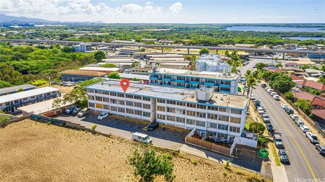 an aerial view of residential houses and city street