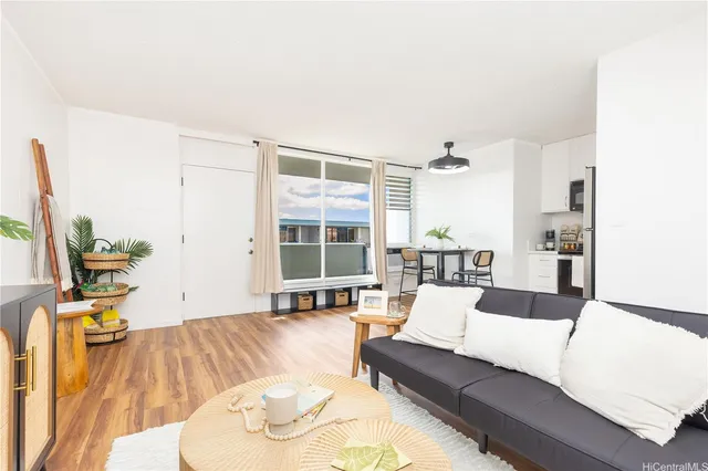 a living room with furniture and a large window