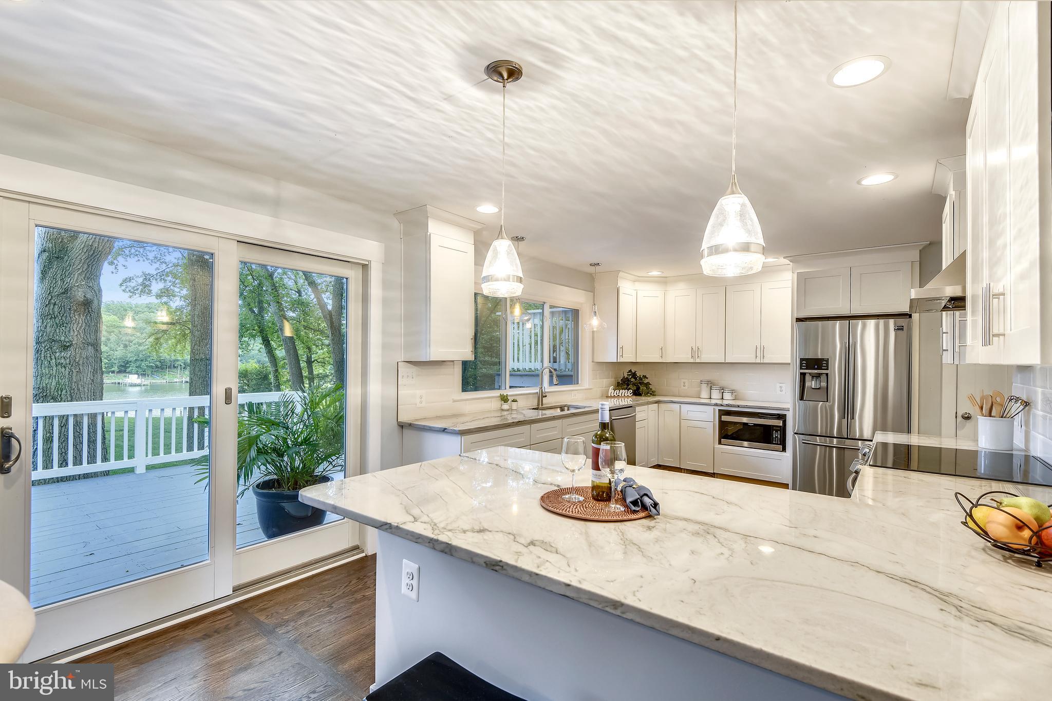 714 Dill Road Severna Park, MD 21146 - Photo 14 of 59 Kitchen with breakfast bar opens to the deck