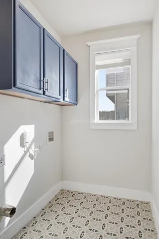a view of a small space with wooden floor and a cabinet