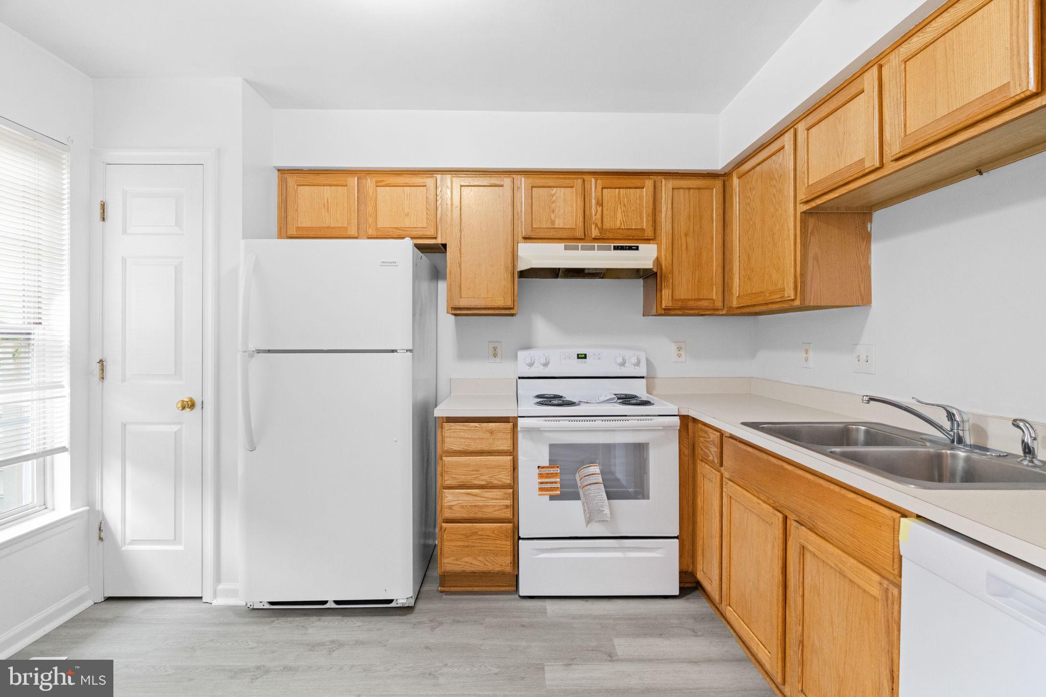 1703 Orchard View Road Reading, PA 19606 - Photo 11 of 53 a kitchen with stainless steel appliances granite countertop a refrigerator sink and cabinets