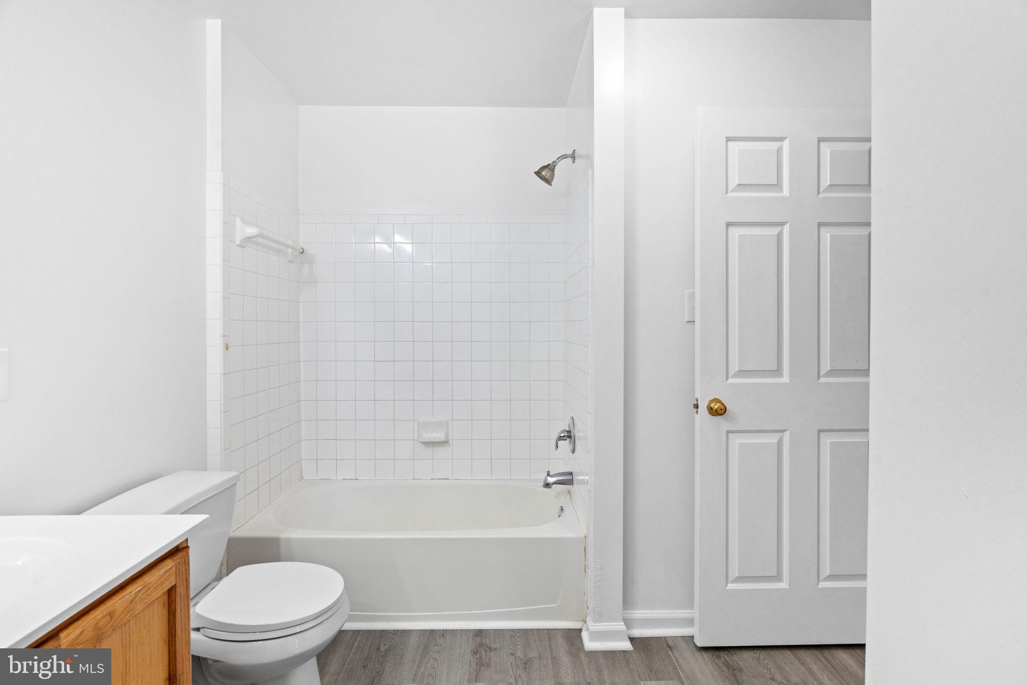 1703 Orchard View Road Reading, PA 19606 - Photo 13 of 53 a bathroom with a toilet a sink and bathtub