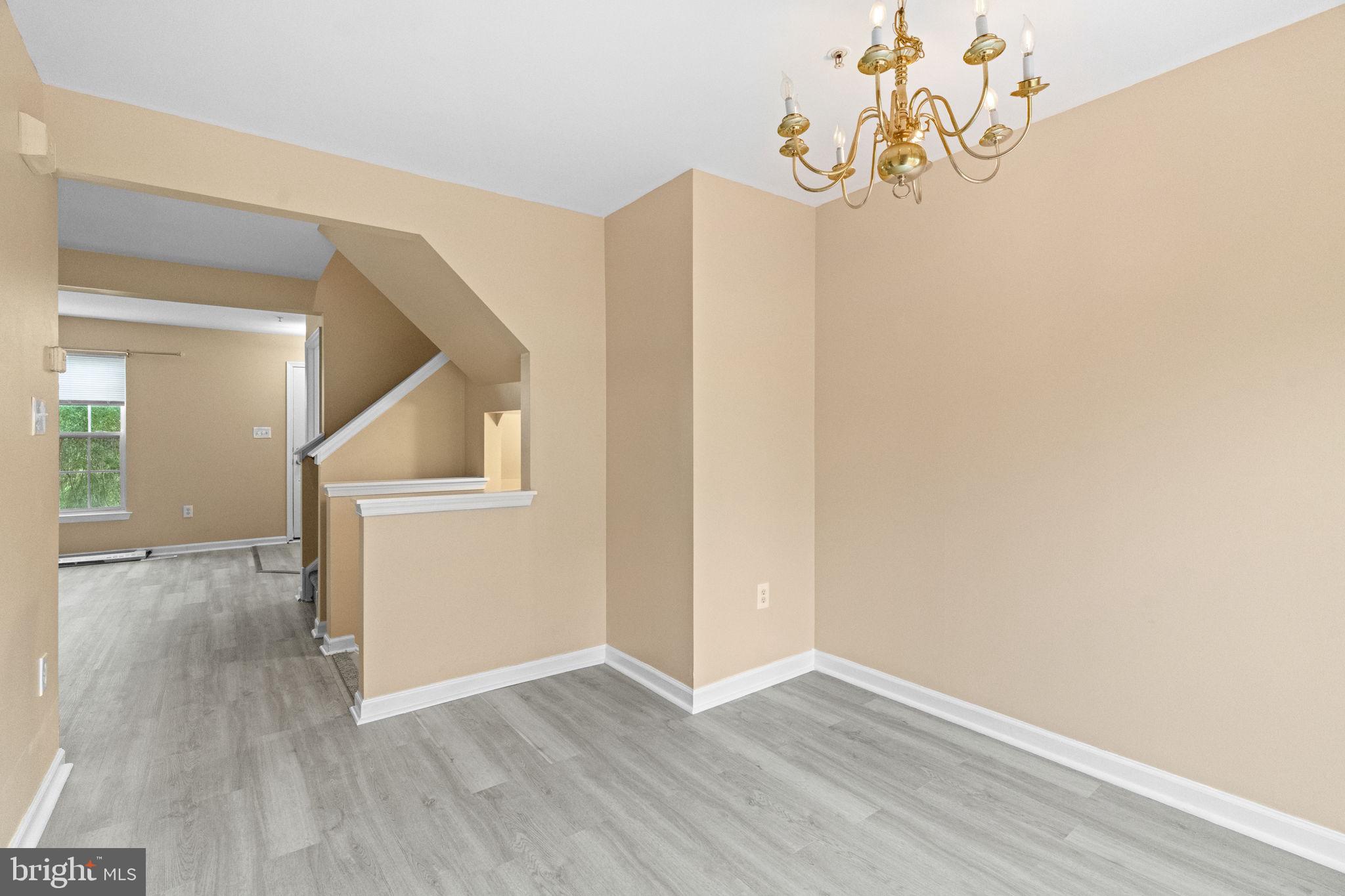1703 Orchard View Road Reading, PA 19606 - Photo 19 of 53 an empty room with wooden floor and hallway