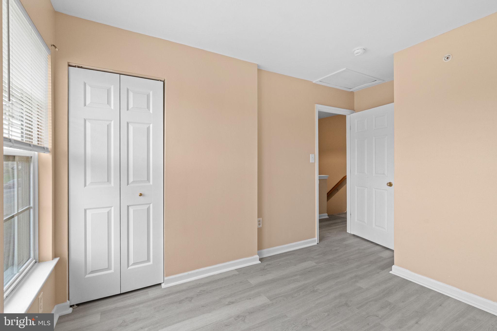 1703 Orchard View Road Reading, PA 19606 - Photo 23 of 53 an empty room with wooden floor and windows