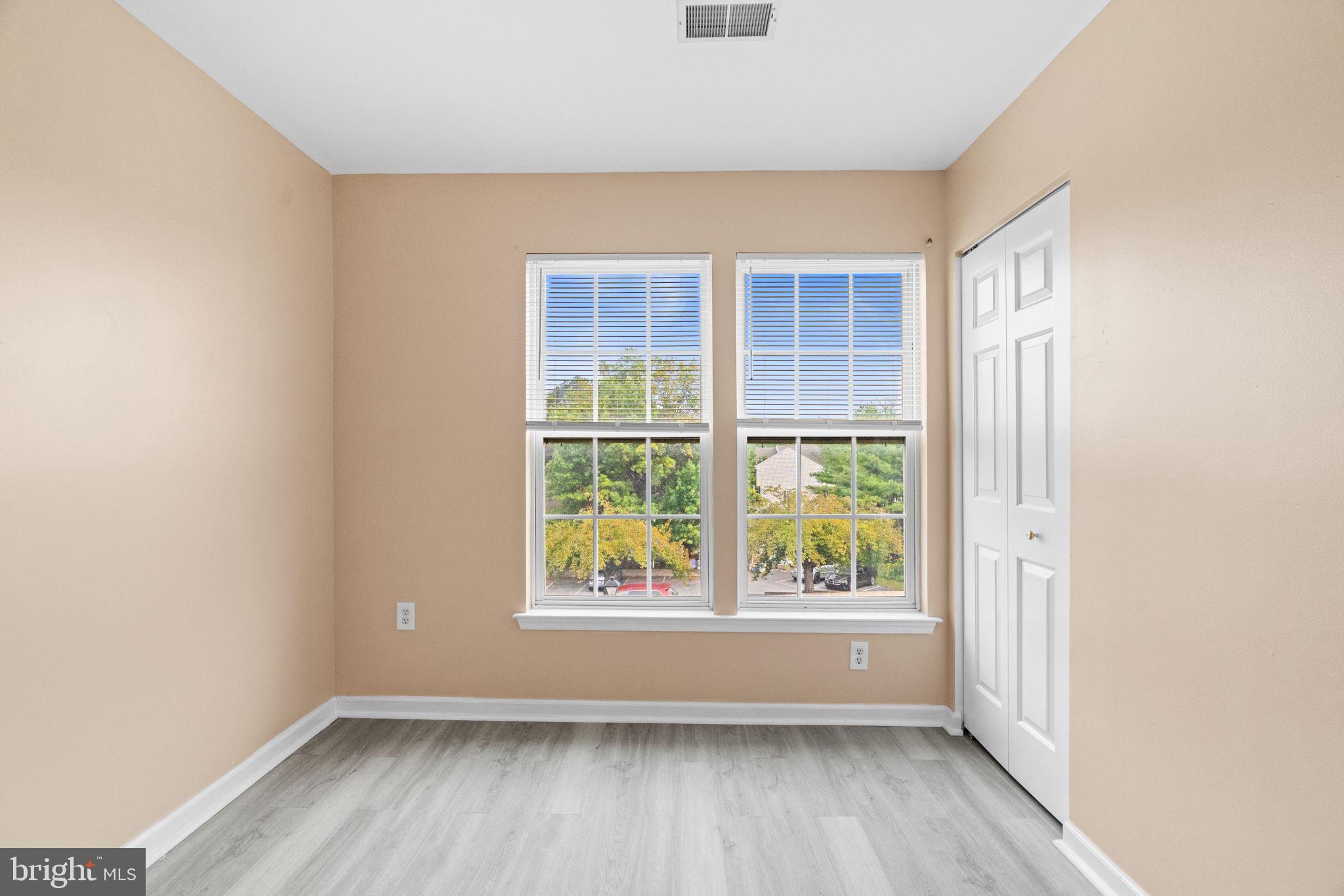 1703 Orchard View Road Reading, PA 19606 - Photo 24 of 53 an empty room with wooden floor and windows