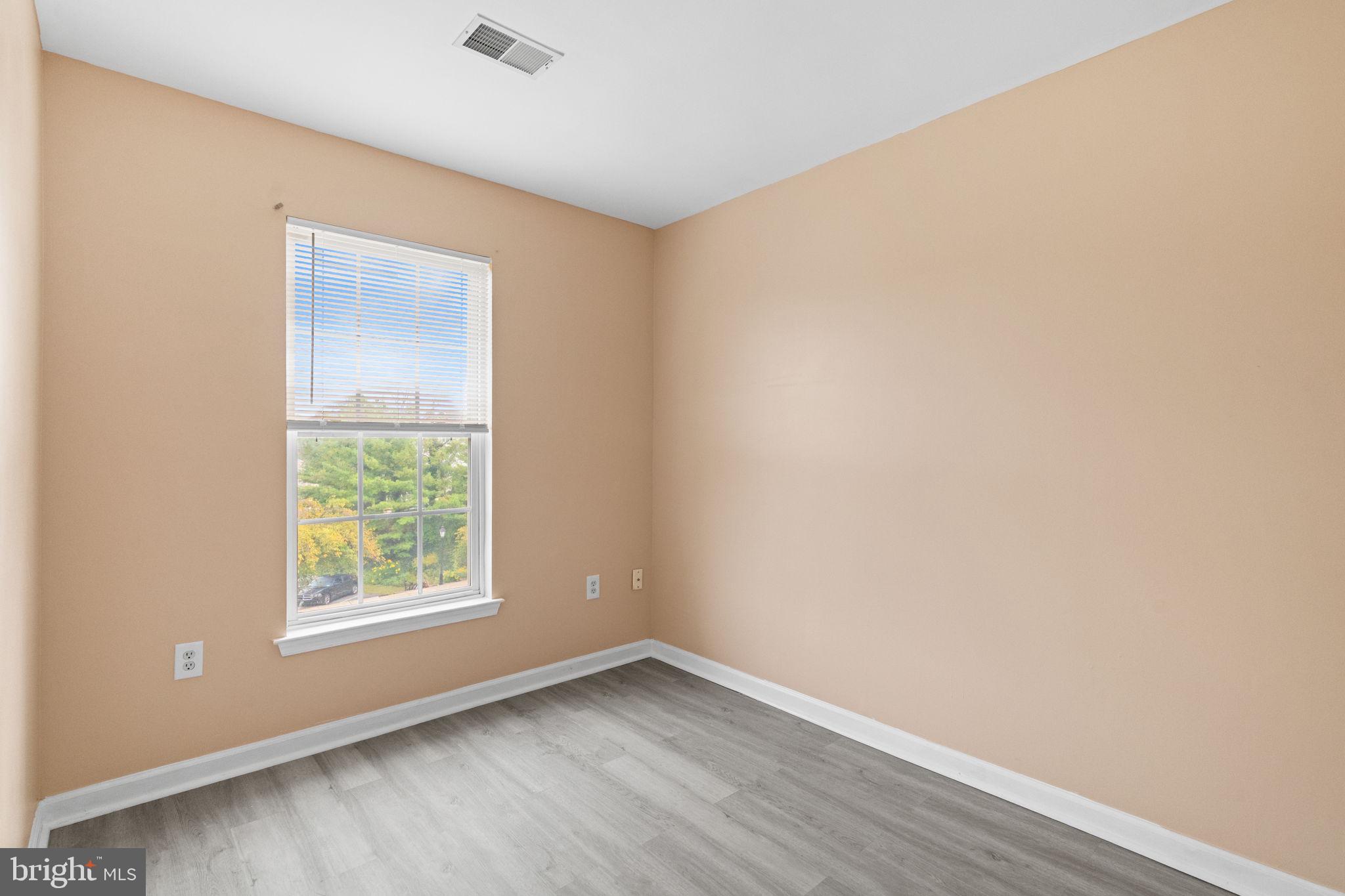 1703 Orchard View Road Reading, PA 19606 - Photo 26 of 53 an empty room with wooden floor and windows