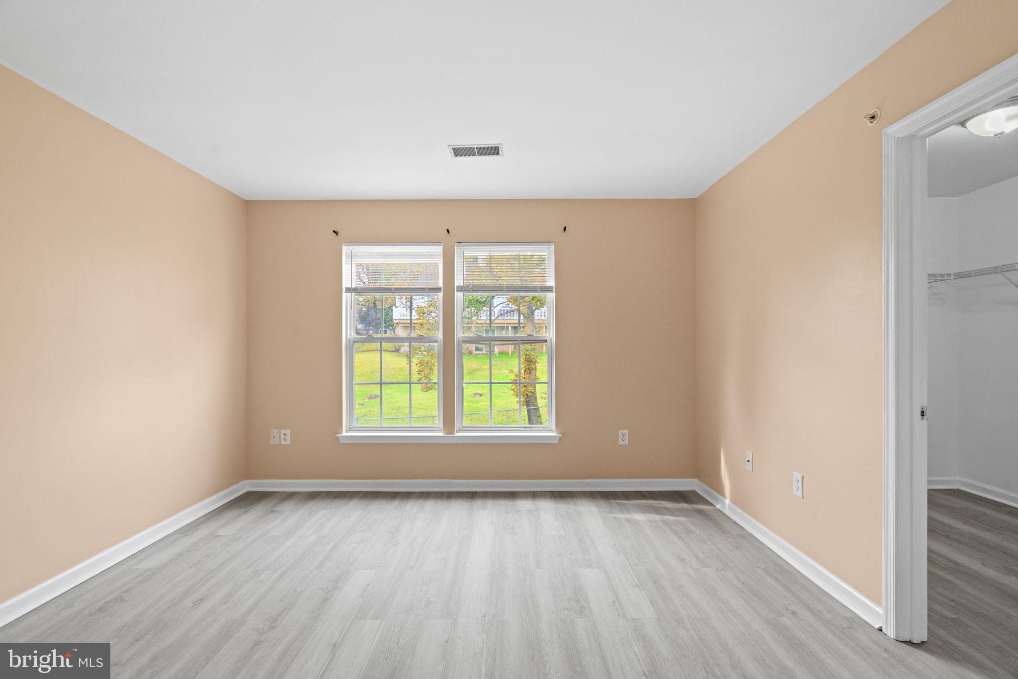 1703 Orchard View Road Reading, PA 19606 - Photo 33 of 53 an empty room with wooden floor and windows