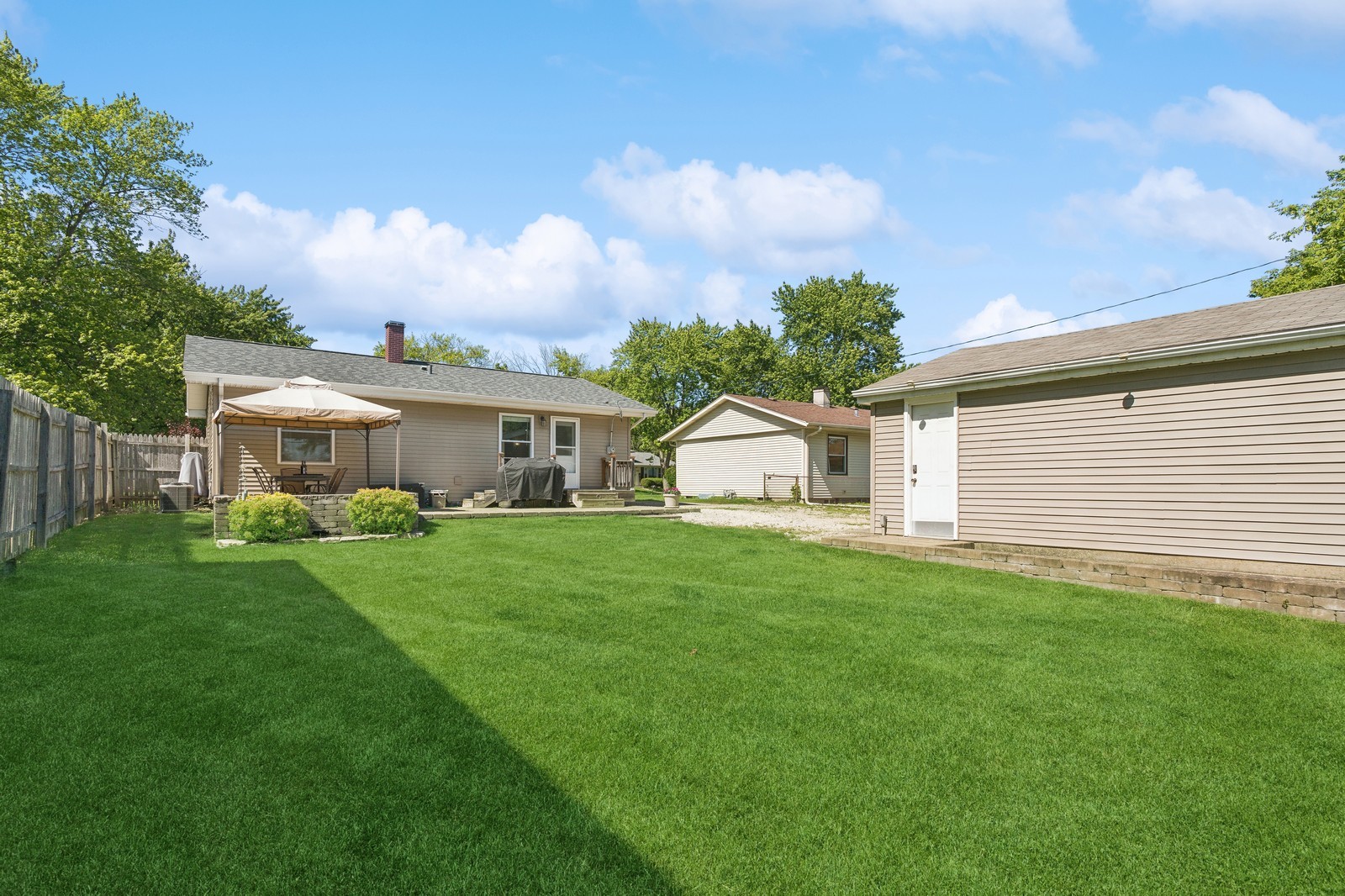 1201 Basin Drive Lockport, IL 60441 - Photo 15 of 16 a front view of a house with a garden and yard