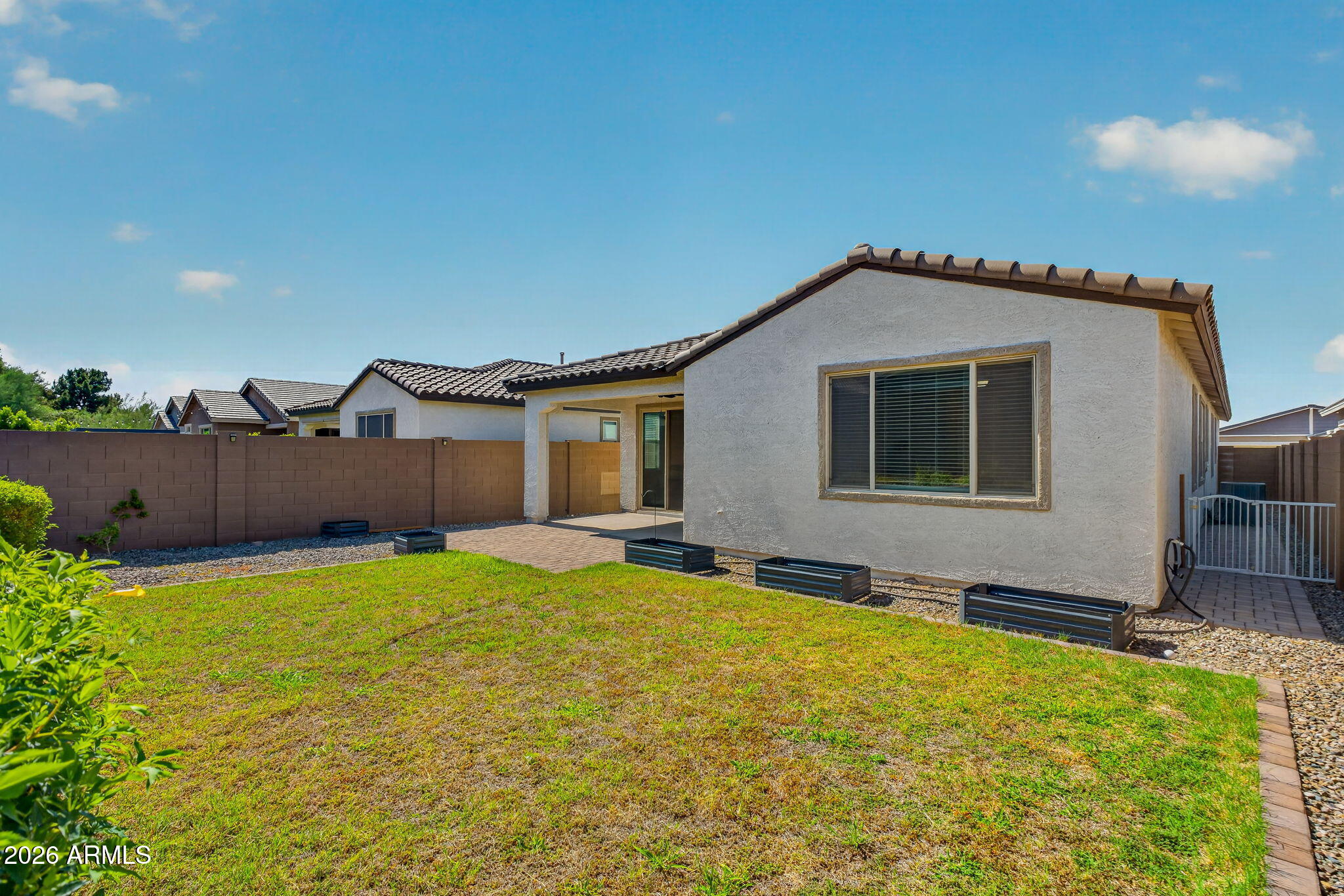 1651 West Estes Way Phoenix, AZ 85041 - Photo 27 of 36 grassy backyard