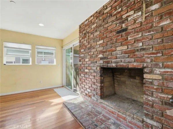 a view of empty room with a fireplace