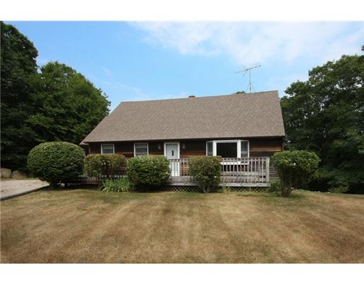 Exterior Front. The huge deck was built along the front of the house. All this needs is a couple of rocking chairs to unwind at the end of the day!