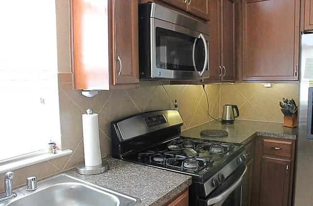 a kitchen with a stove and a microwave