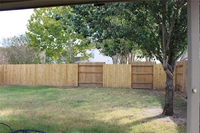 a view of backyard with tree