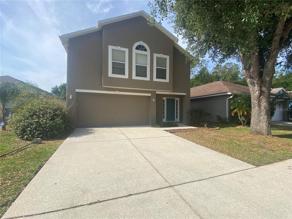front view of a house with a yard