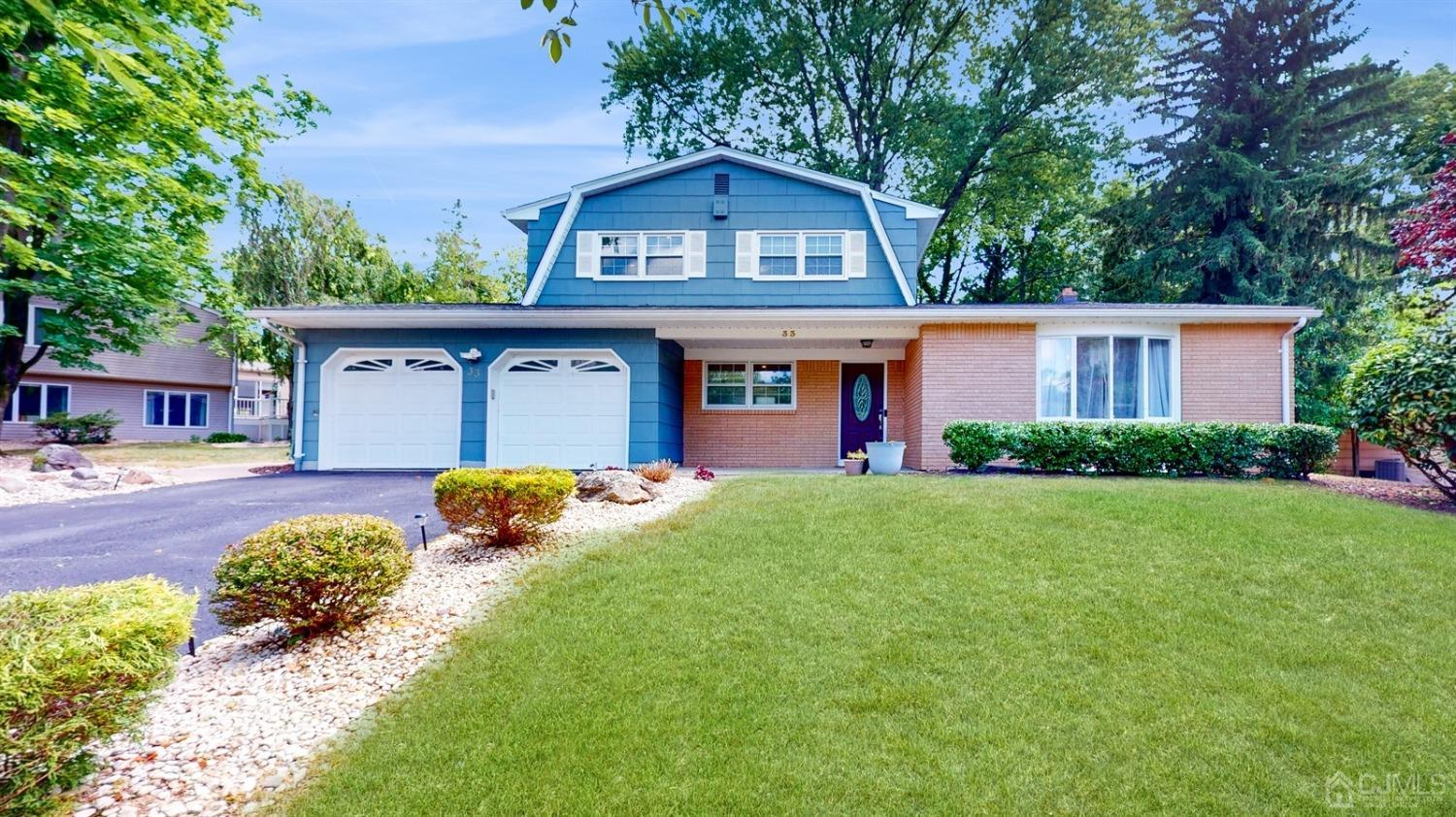 33 Rath Lane East Brunswick, NJ 08816 - Photo 1 of 1 a front view of a house with garden