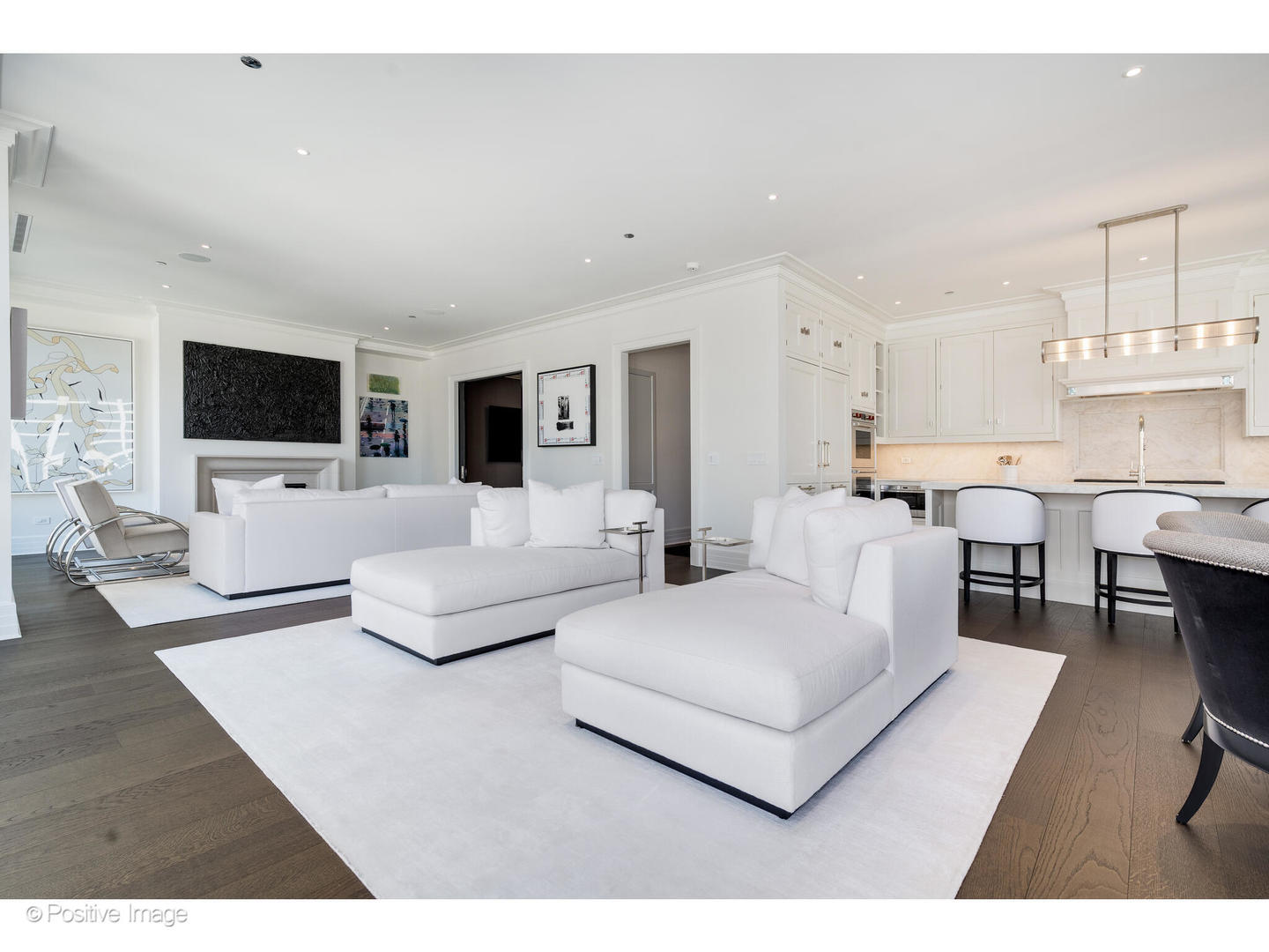 9 West Walton Street, Unit 1501 Chicago, IL 60610 - Photo 12 of 37 a living room with furniture and a flat screen tv