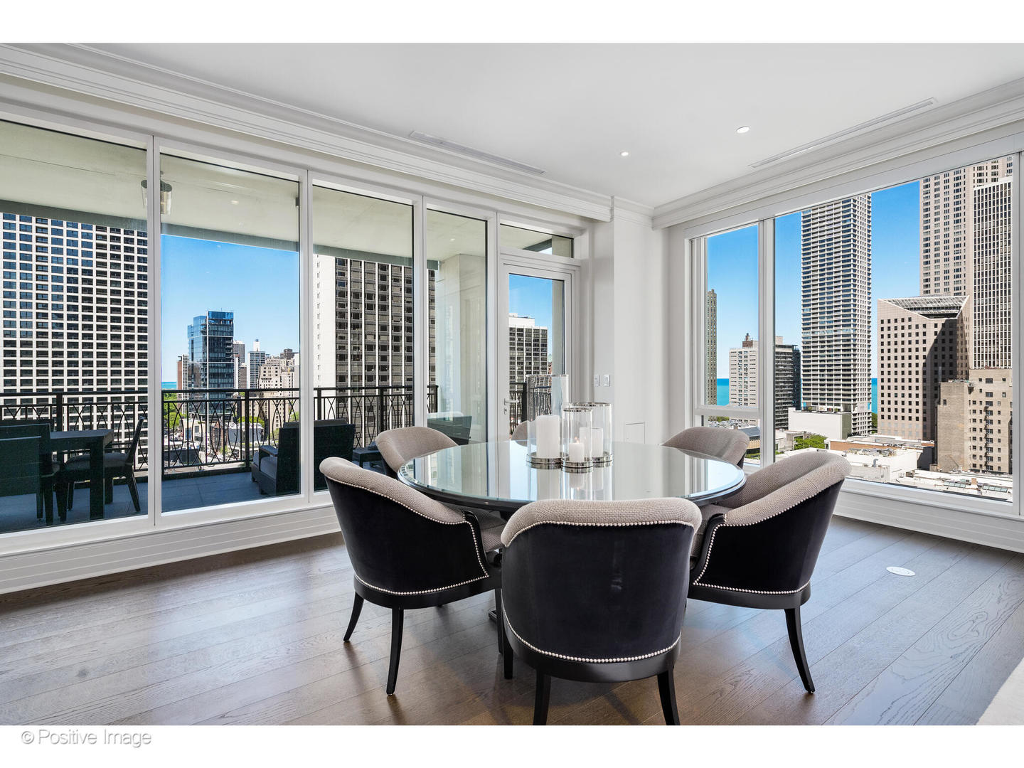 9 West Walton Street, Unit 1501 Chicago, IL 60610 - Photo 13 of 37 a dining room with furniture and wooden floor
