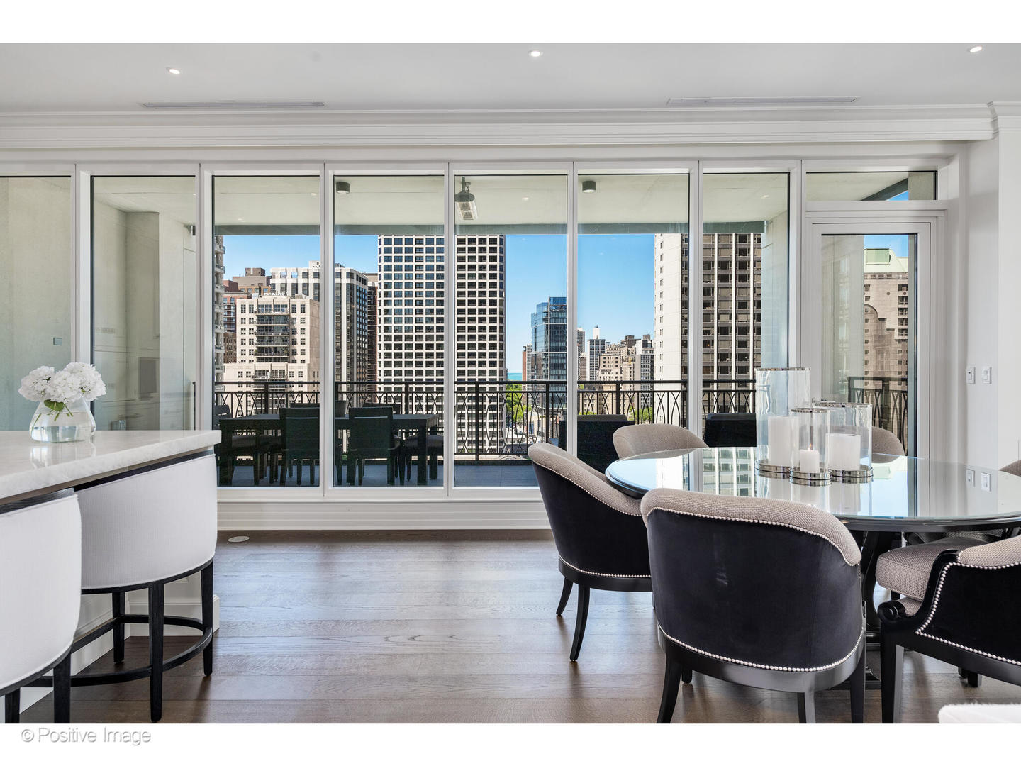 9 West Walton Street, Unit 1501 Chicago, IL 60610 - Photo 14 of 37 a dining room with furniture and wooden floor