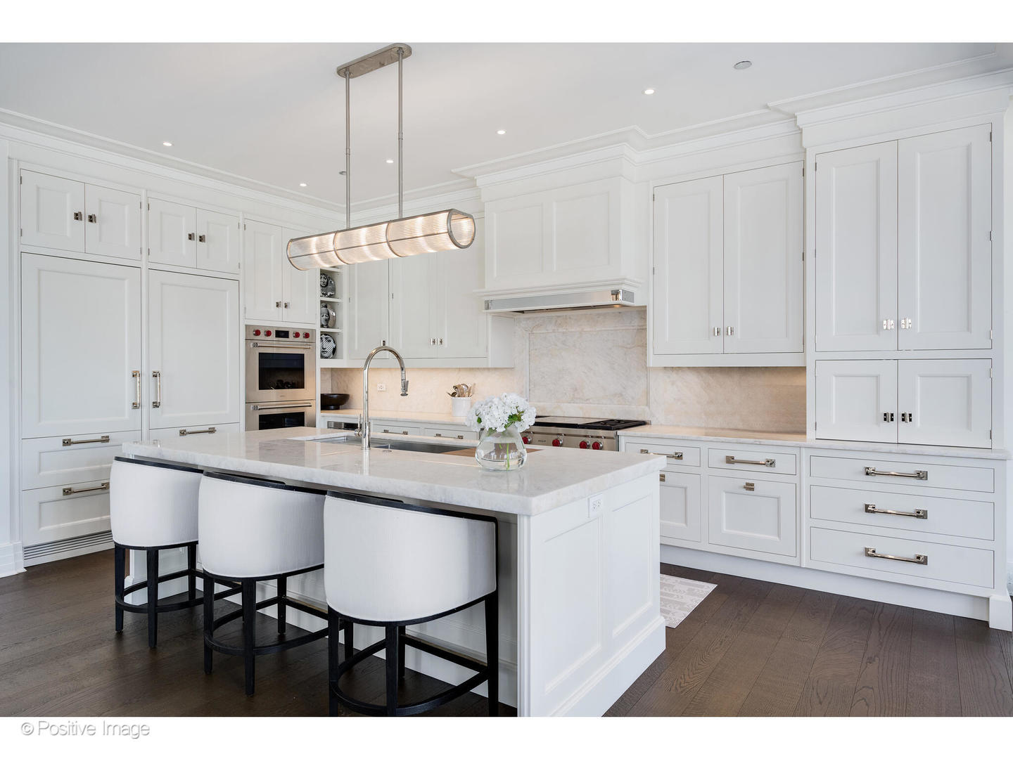 9 West Walton Street, Unit 1501 Chicago, IL 60610 - Photo 16 of 37 a kitchen with white cabinets and white appliances