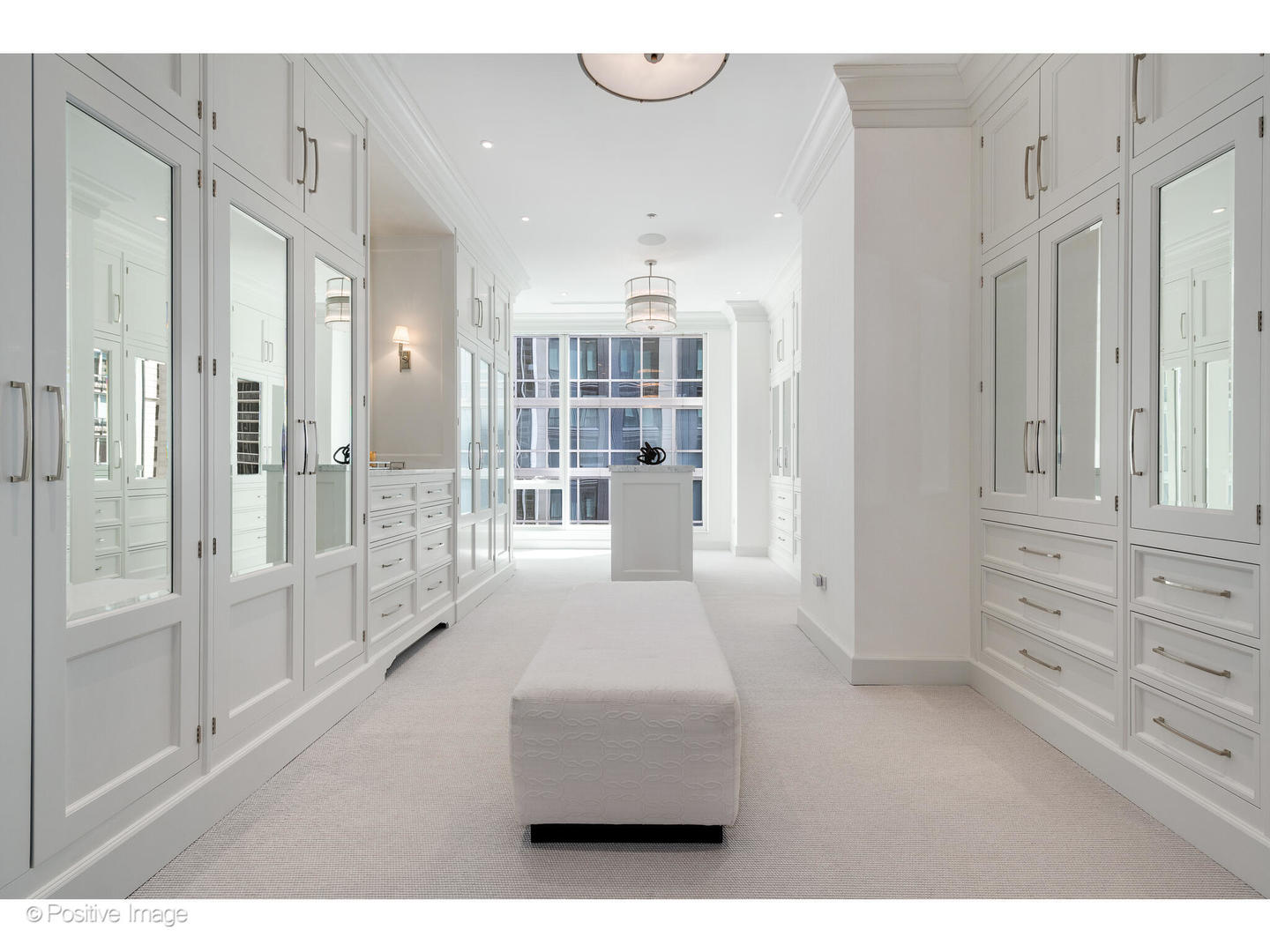 9 West Walton Street, Unit 1501 Chicago, IL 60610 - Photo 25 of 37 a living room with furniture and a chandelier