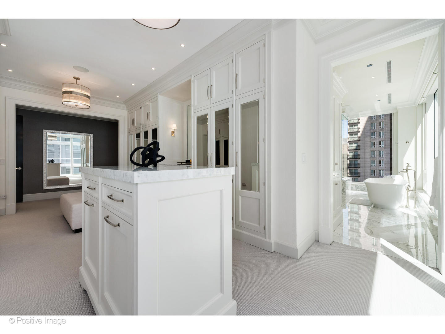 9 West Walton Street, Unit 1501 Chicago, IL 60610 - Photo 26 of 37 a view of living room and kitchen with furniture