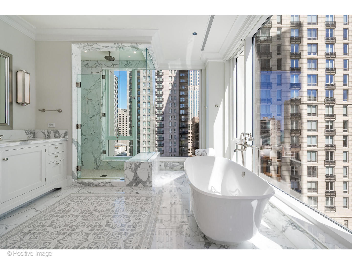 9 West Walton Street, Unit 1501 Chicago, IL 60610 - Photo 27 of 37 a bathroom with a bathtub a sink and a shower