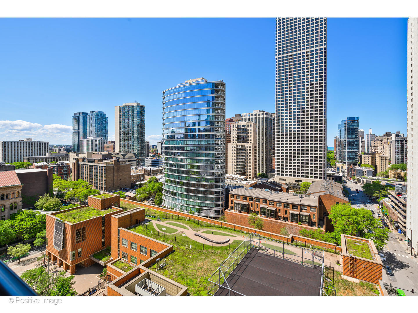 9 West Walton Street, Unit 1501 Chicago, IL 60610 - Photo 35 of 37 a view of a city with tall buildings